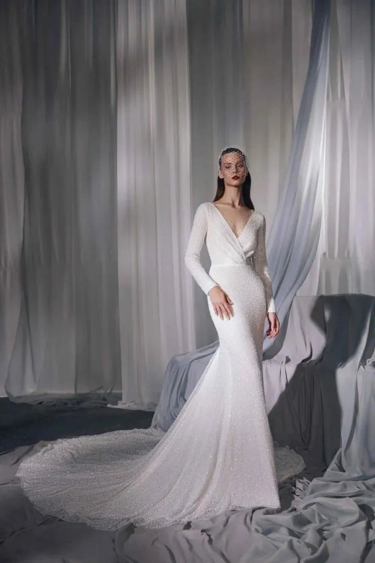 Graceful Minimalist A-Line Bridal Gown with Long Sleeves, V-Neckline, Lace Embellishments, and Natural Waistline for a Stunning Look - Camilla's