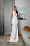 Minimalist Mermaid Wedding Dress with Straps, Asymmetric Neckline, and Lace Embellishments for a Modern Bridal Look