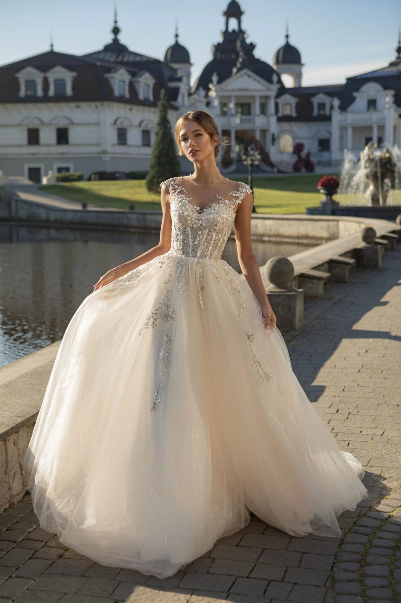 Modern A-Line Wedding Dress with Sweetheart Neckline, Cap Sleeves, Lace Appliques, and Sweep Train for a Romantic Bridal Look