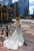 Elegant Mermaid Wedding Gown with Long Sleeves, V-Neckline, and a Flattering Dropped Waist for a Breathtaking Bridal Look