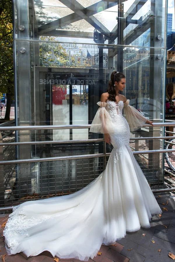 Elegant Mermaid Wedding Gown with Long Sleeves, V-Neckline, and a Flattering Dropped Waist for a Breathtaking Bridal Look