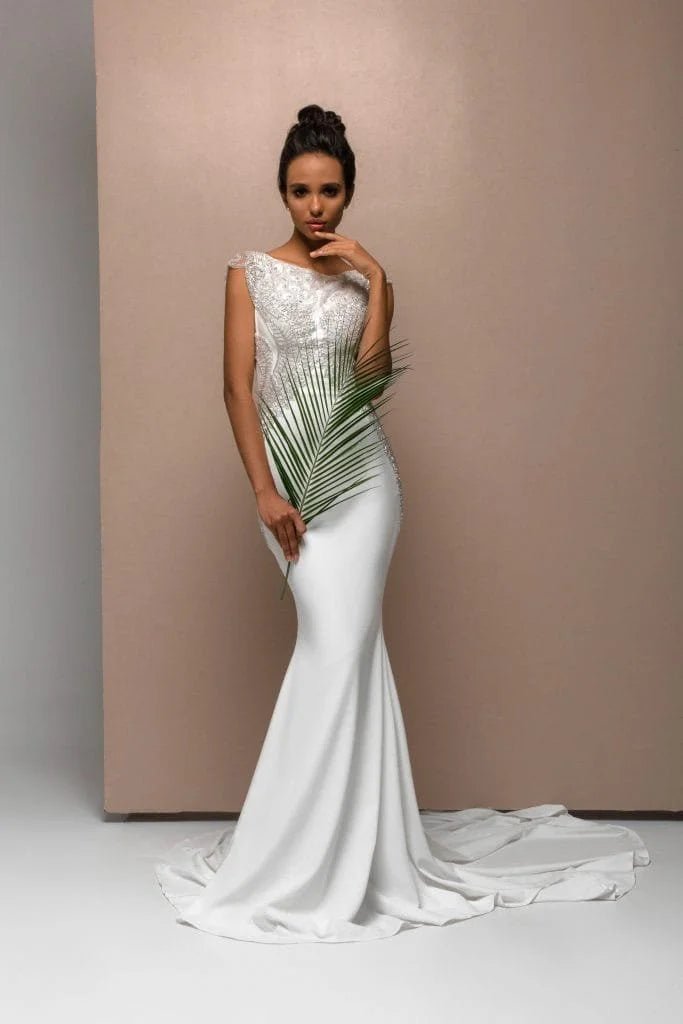 Romantic Mermaid Wedding Gown with Straps, Boat Neckline, and Lace Embellishments for a Timeless Bridal Look