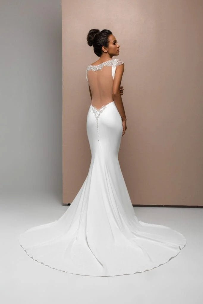 Romantic Mermaid Wedding Gown with Straps, Boat Neckline, and Lace Embellishments for a Timeless Bridal Look