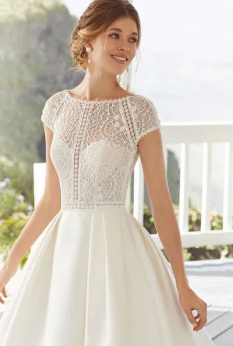 Graceful A-Line Wedding Gown with Cap Sleeves, Jewel Neckline, and a Flattering Natural Waist for a Timeless and Elegant Bridal Look