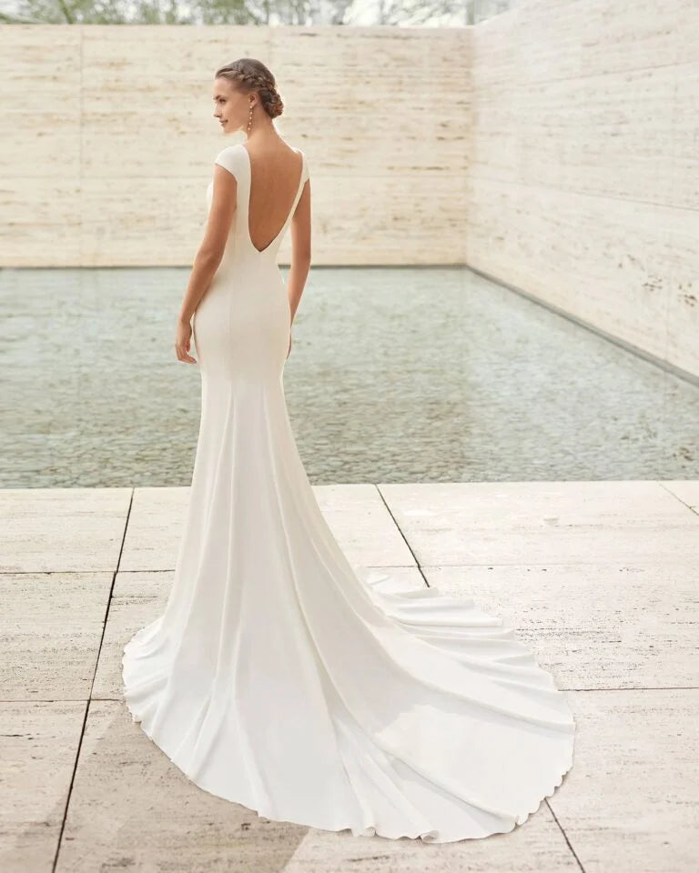 Elegant Mermaid Wedding Gown with Exquisite Lace Detailing, Graceful Cap Sleeves, and a Sophisticated Boat Neckline for a Timeless and Flattering Bridal Look