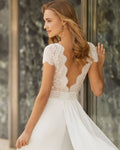 Timeless A-Line Wedding Gown with Exquisite Lace Detailing, Graceful Cap Sleeves, and a Sophisticated Boat Neckline for an Elegant and Romantic Bridal Look