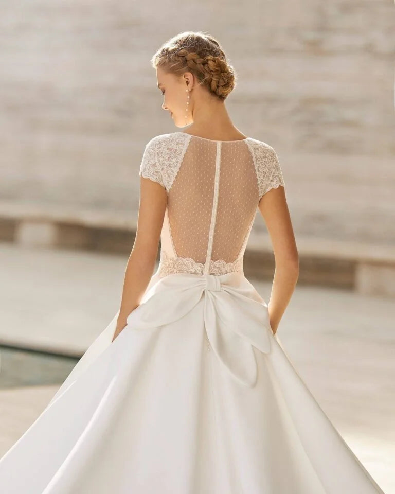 Romantic A-Line Wedding Gown with Delicate Lace Detailing, Elegant Cap Sleeves, and a Flattering V-Neckline for a Timeless and Graceful Bridal Look