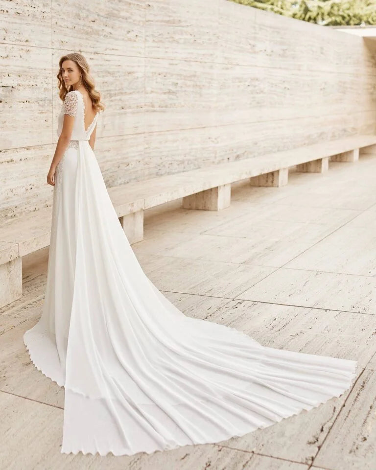 Sophisticated Sheath Wedding Dress with Elegant Long Sleeves, Boat Neckline, and a Flattering Natural Waistline for a Timeless Bridal Look