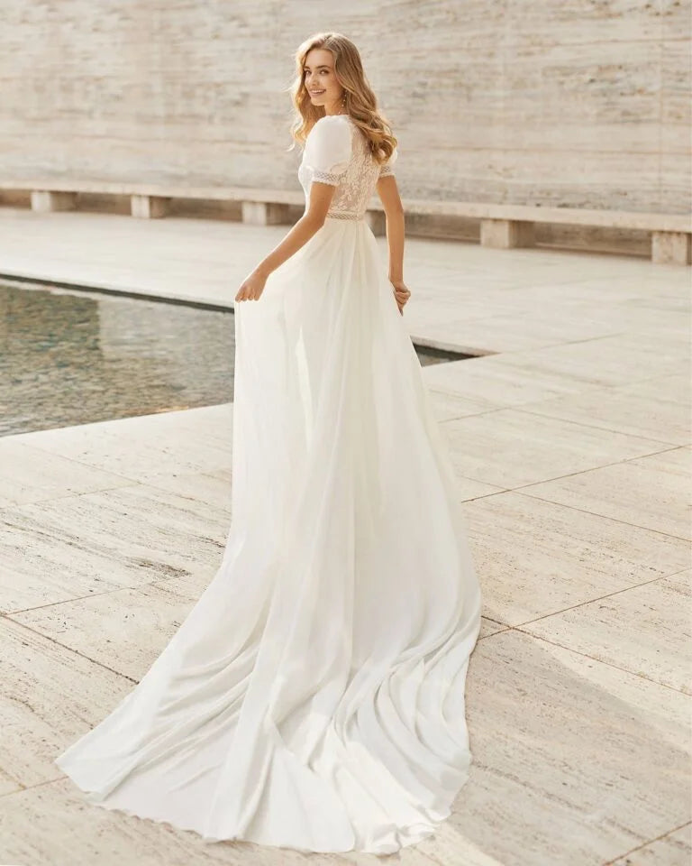 Romantic A-Line Wedding Gown with Delicate Lace Detailing, Graceful Cap Sleeves, and a Flattering V-Neckline for a Timeless and Elegant Bridal Look