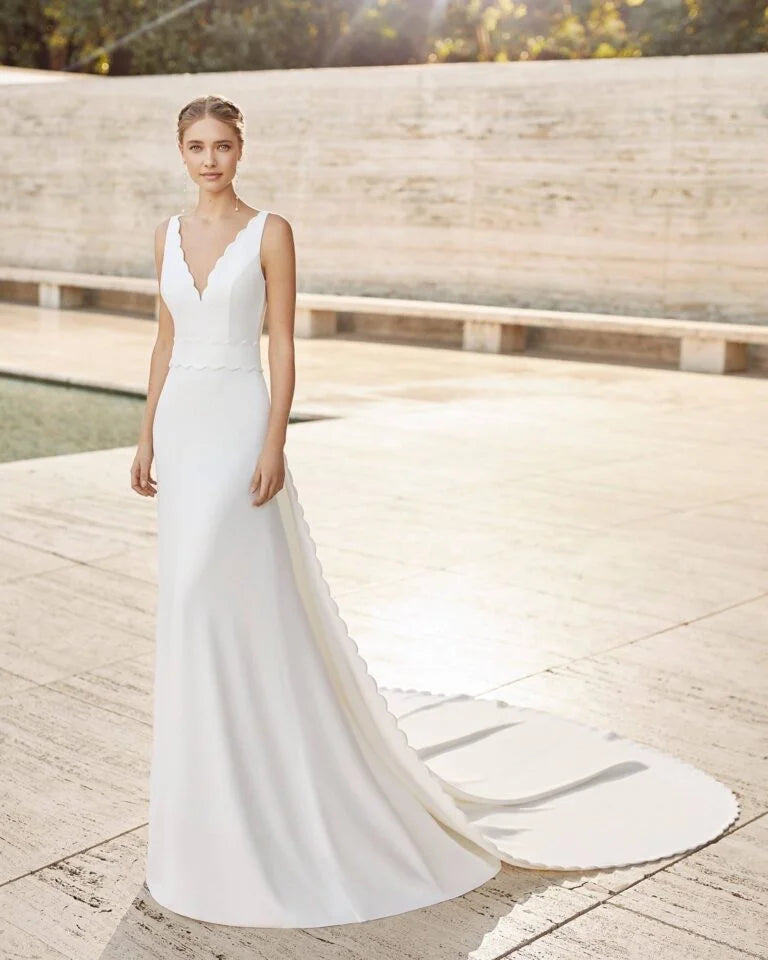 Graceful Sheath Wedding Gown with Delicate Lace Detailing, Dainty Spaghetti Straps, and a Flattering V-Neckline for a Romantic and Timeless Bridal Look