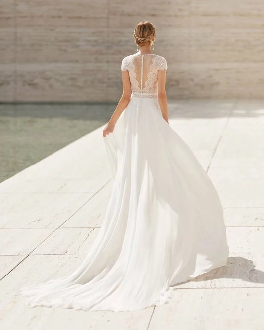 Elegant Sheath Wedding Gown with Delicate Lace Detailing, Graceful Cap Sleeves, and a Flattering V-Neckline for a Timeless and Romantic Bridal Look