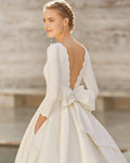 Elegant A-Line Wedding Gown with Exquisite Lace Detailing, Graceful Long Sleeves, a Sophisticated Boat Neckline, and a Flattering Dropped Waist for a Timeless and Regal Bridal Look