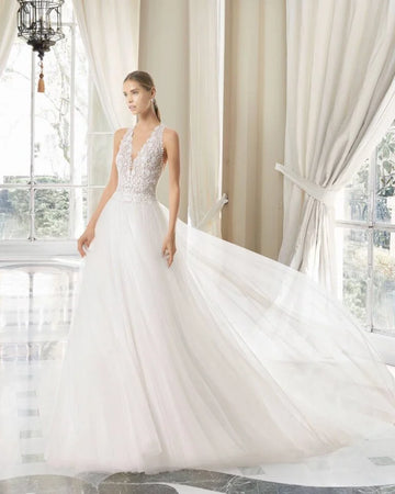 Romantic A-Line Wedding Gown with Delicate Spaghetti Straps, Elegant V-Neckline, and Intricate Lace Detailing for a Breathtaking Bridal Look