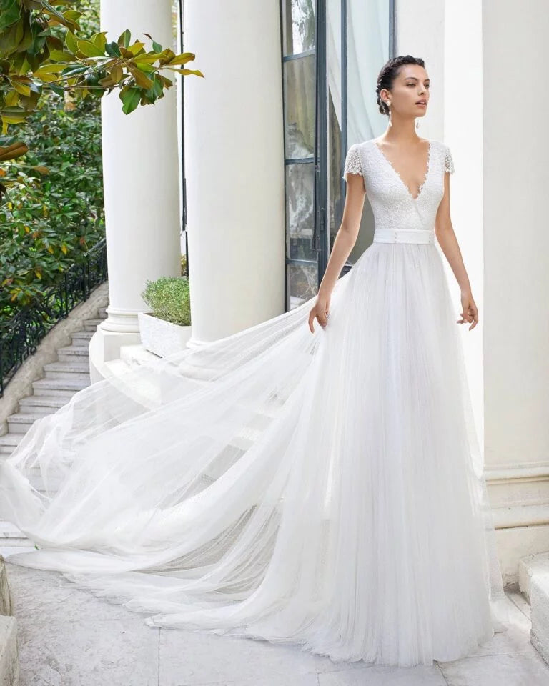 Ethereal A-Line Wedding Gown with Graceful Cap Sleeves, a Flattering V-Neckline, and Delicate Lace Detailing for a Timeless Bridal Look