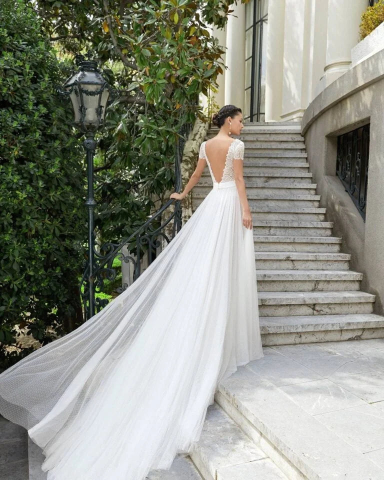 Ethereal A-Line Wedding Gown with Graceful Cap Sleeves, a Flattering V-Neckline, and Delicate Lace Detailing for a Timeless Bridal Look