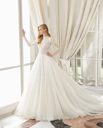 Timeless A-Line Wedding Gown with Elegant Lace Detailing, Graceful Long Sleeves, and a Sophisticated High-Neckline for a Regal and Romantic Bridal Look