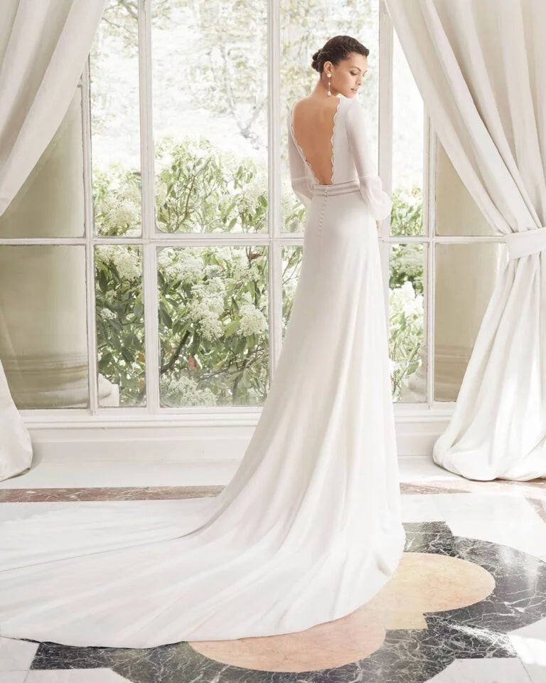 Sophisticated Sheath Wedding Gown with Elegant Lace Detailing, Chic Long Sleeves, and a Graceful Halter Neckline for a Modern Yet Timeless Bridal Look