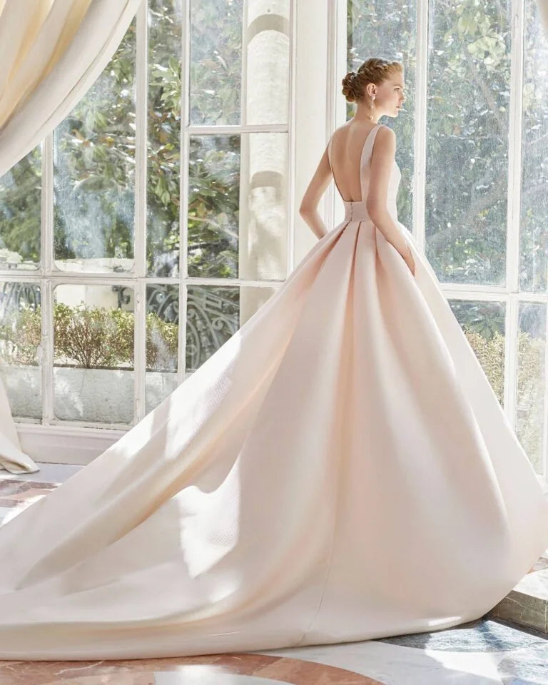 Fairytale Ball Gown Wedding Dress with Delicate Spaghetti Straps, a Flattering V-Neckline, and a Graceful Dropped Waist for a Breathtaking and Regal Bridal Look