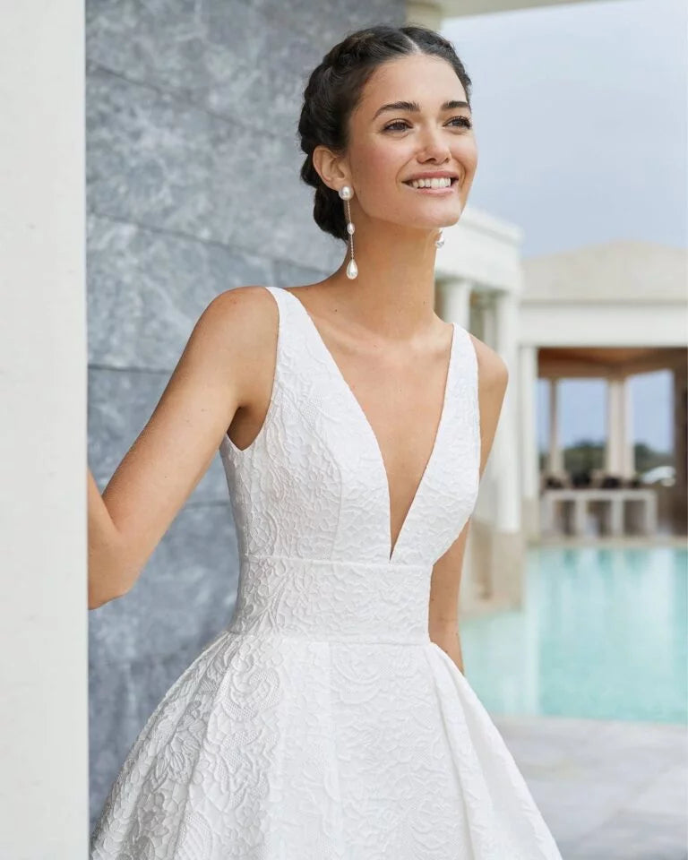 Romantic A-Line Wedding Gown with Delicate Lace Detailing, Elegant Spaghetti Straps, a Flattering V-Neckline, and a Graceful Dropped Waist for a Timeless and Breathtaking Bridal Look