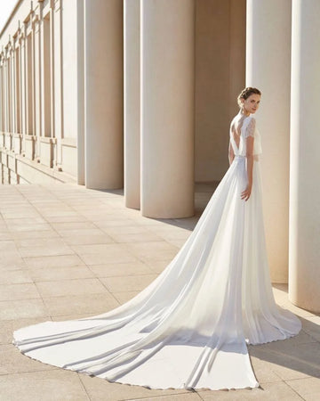 Sophisticated Sheath Wedding Gown with Elegant Lace Detailing, Graceful Long Sleeves, and a Chic Boat Neckline for a Timeless and Refined Bridal Look