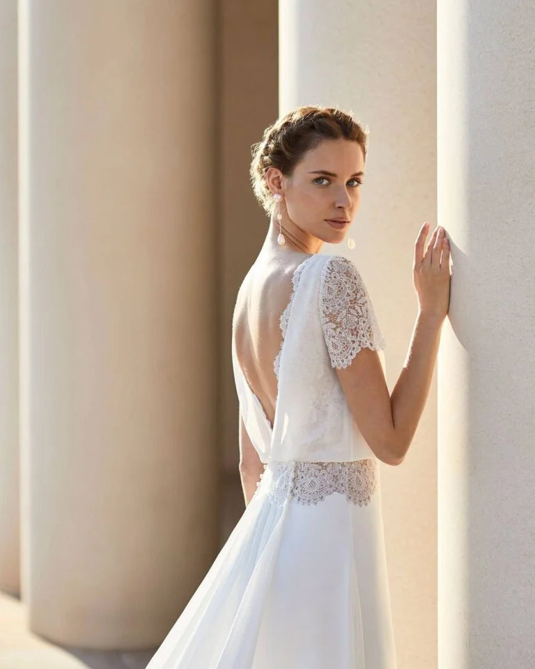 Sophisticated Sheath Wedding Gown with Elegant Lace Detailing, Graceful Long Sleeves, and a Chic Boat Neckline for a Timeless and Refined Bridal Look