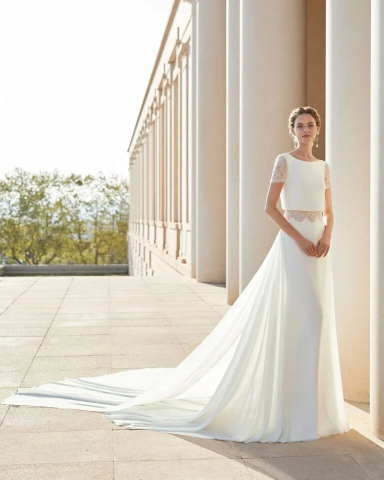 Sophisticated Sheath Wedding Gown with Elegant Lace Detailing, Graceful Long Sleeves, and a Chic Boat Neckline for a Timeless and Refined Bridal Look