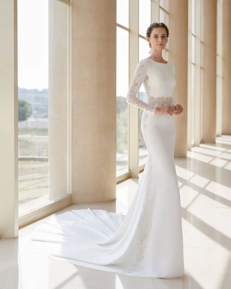 Elegant Trumpet Wedding Gown with Exquisite Lace Detailing, Graceful Long Sleeves, and a Sophisticated Boat Neckline for a Timeless and Striking Bridal Look