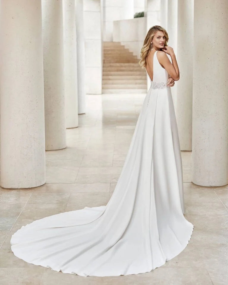 Elegant Sheath Wedding Gown with Delicate Lace Detailing, Dainty Spaghetti Straps, and a Flattering V-Neckline for a Romantic and Timeless Bridal Look