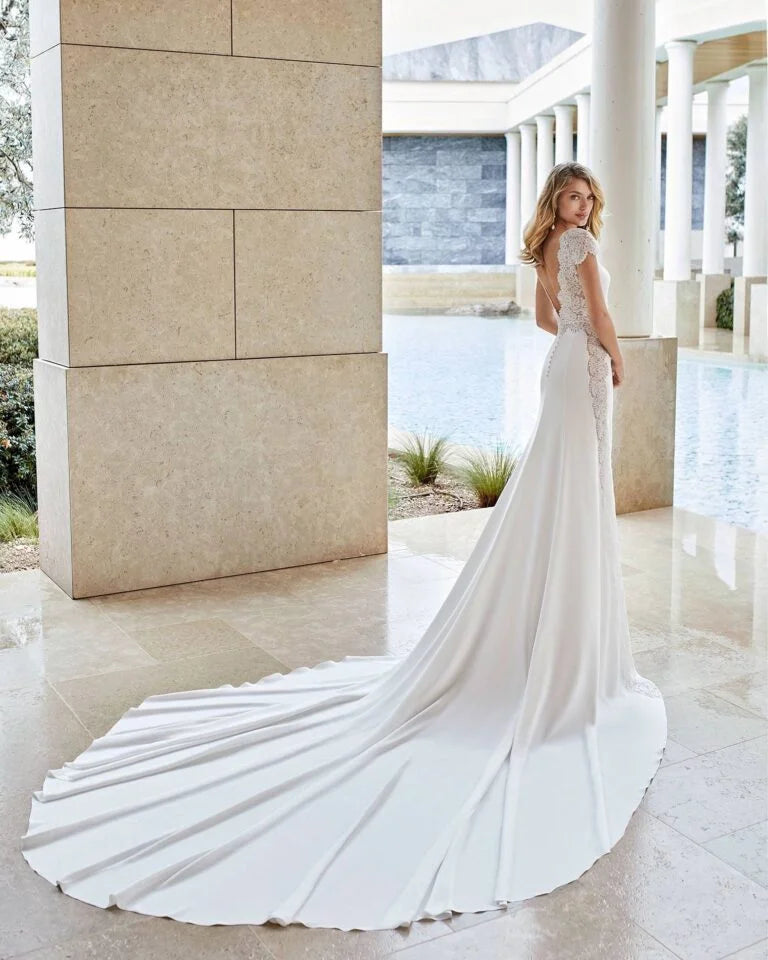 Timeless Sheath Wedding Gown with Exquisite Lace Detailing, Elegant Cap Sleeves, and a Sophisticated Boat Neckline for a Graceful and Refined Bridal Look