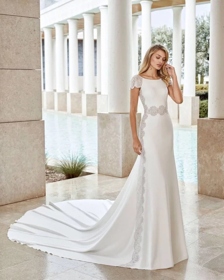 Timeless Sheath Wedding Gown with Exquisite Lace Detailing, Elegant Cap Sleeves, and a Sophisticated Boat Neckline for a Graceful and Refined Bridal Look