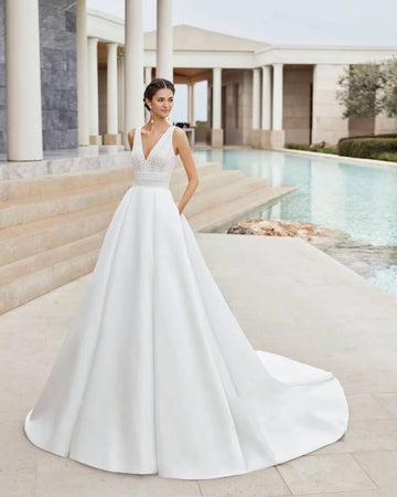 Romantic A-Line Wedding Gown with Delicate Lace Detailing, Elegant Spaghetti Straps, and a Flattering V-Neckline for a Timeless and Breathtaking Bridal Look