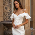 Sexy White Mermaid Wedding Dress with a Deep Cut-Out Back for a Modern Feel