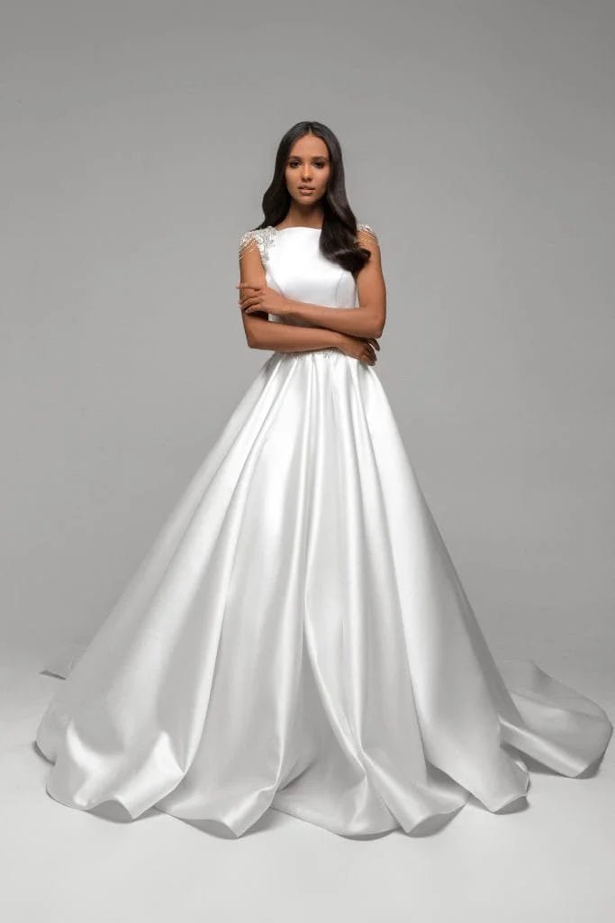 Simple A-Line Wedding Dress with Spaghetti Straps, Boat Neckline, and Lace Embellishments for a Chic Bridal Look