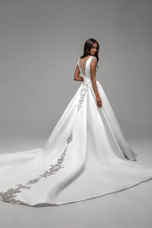 Simple A-Line Wedding Dress with Spaghetti Straps, Boat Neckline, and Lace Embellishments for a Chic Bridal Look