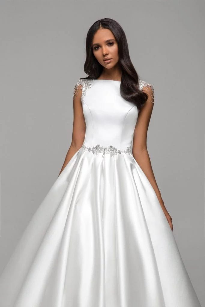 Simple A-Line Wedding Dress with Spaghetti Straps, Boat Neckline, and Lace Embellishments for a Chic Bridal Look