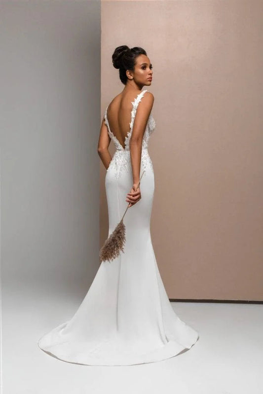 Sophisticated Mermaid Wedding Gown with Straps, Illusion Neckline, and Lace Embellishments for a Chic Bridal Look