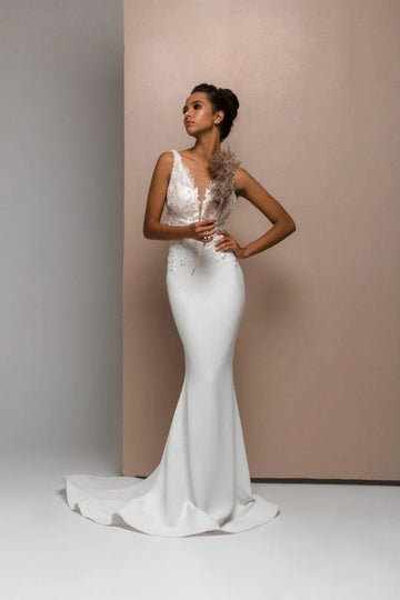 Sophisticated Mermaid Wedding Gown with Straps, Illusion Neckline, and Lace Embellishments for a Chic Bridal Look