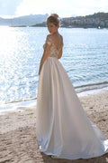 Ethereal A-Line Wedding Gown with Delicate Cap Sleeves, a Romantic Off-Shoulder Neckline, for a Timeless and Enchanting Bridal Look