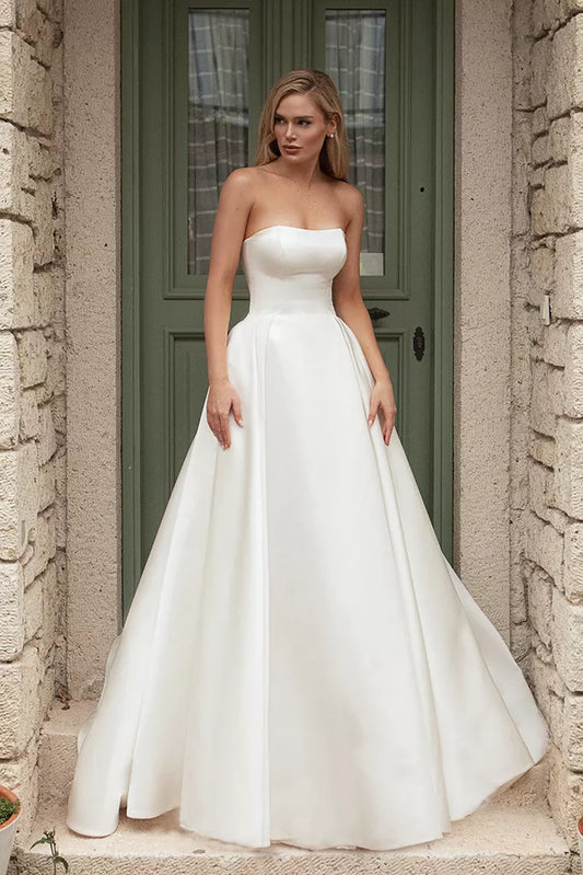 Romantic A-Line Wedding Gown with a Graceful Off-Shoulder Neckline, and a Flattering Natural Waistline for an Enchanting and Timeless Bridal Look