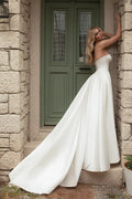 Romantic A-Line Wedding Gown with a Graceful Off-Shoulder Neckline, and a Flattering Natural Waistline for an Enchanting and Timeless Bridal Look