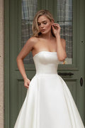 Romantic A-Line Wedding Gown with a Graceful Off-Shoulder Neckline, and a Flattering Natural Waistline for an Enchanting and Timeless Bridal Look