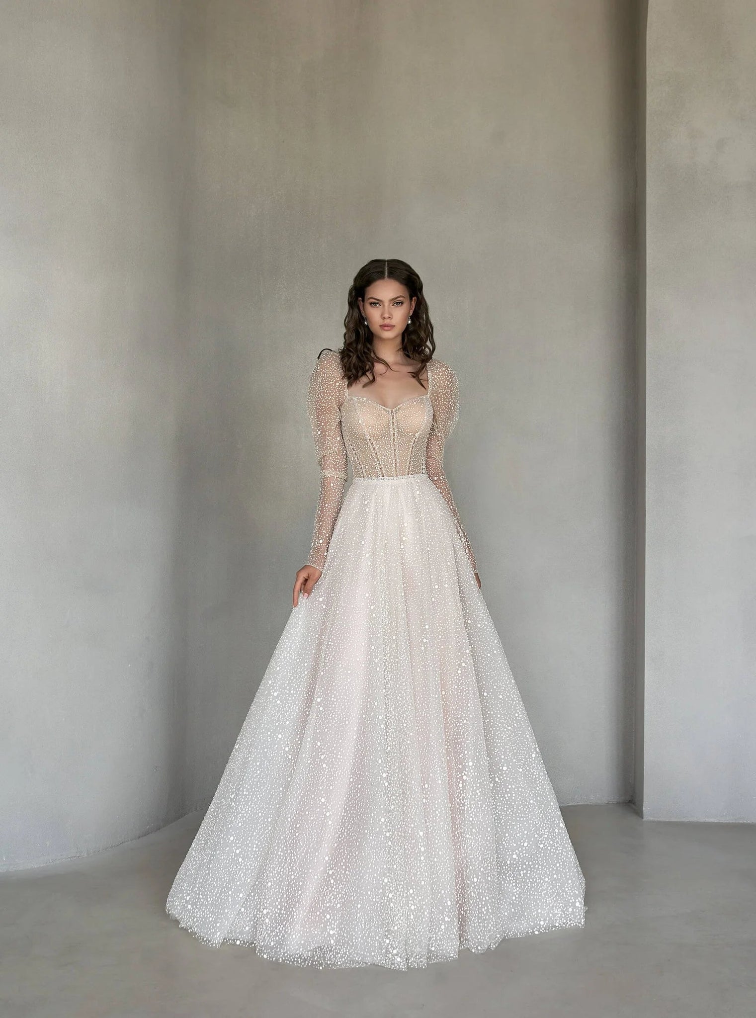 Timeless A-Line Wedding Dress with Long Sleeves, Sweetheart Neckline, and Elegant Lace Embellishments