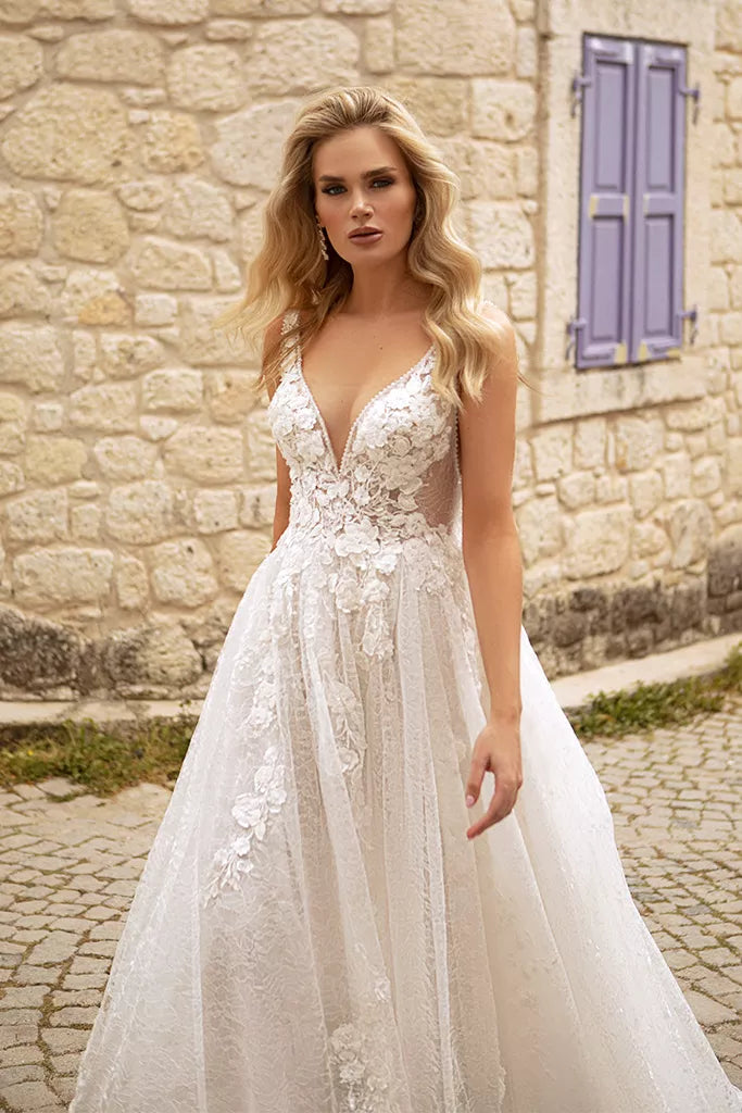 Ethereal A-Line Wedding Gown with Delicate Spaghetti Straps, a Flattering V-Neckline for a Romantic and Timeless Bridal Look