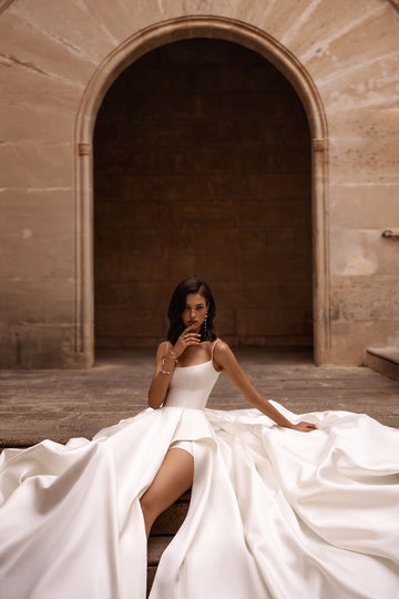 gnite the atmosphere with our mesmerizing A-line wedding dress, a true embodiment of glamour and allure