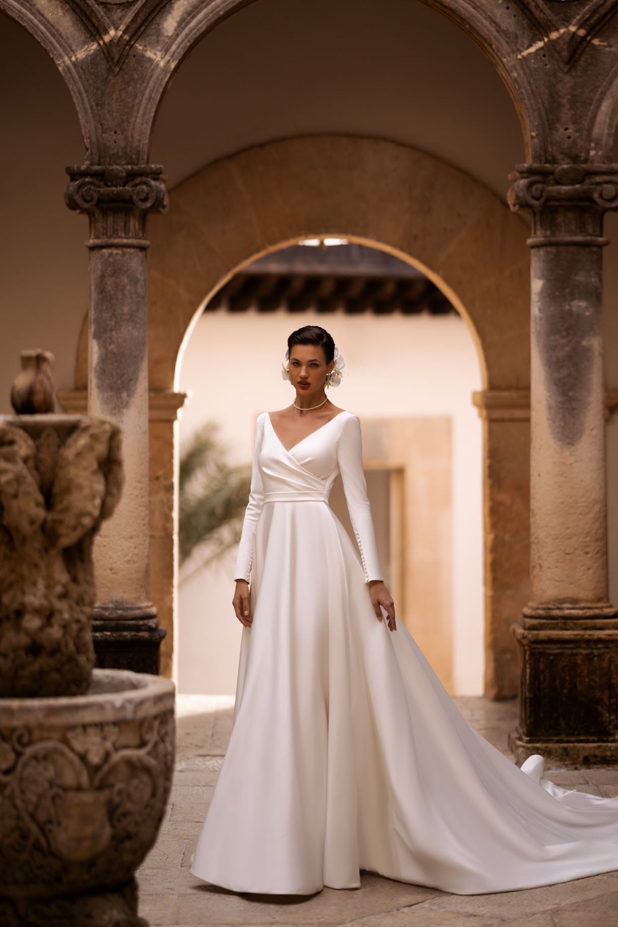 Introducing our exquisite A-line wrap wedding dress, a harmonious blend of modernity and classic elegance. Crafted from luxurious glossy fabric, it drapes gracefully to accentuate your silhouette with a sense of refined beauty.